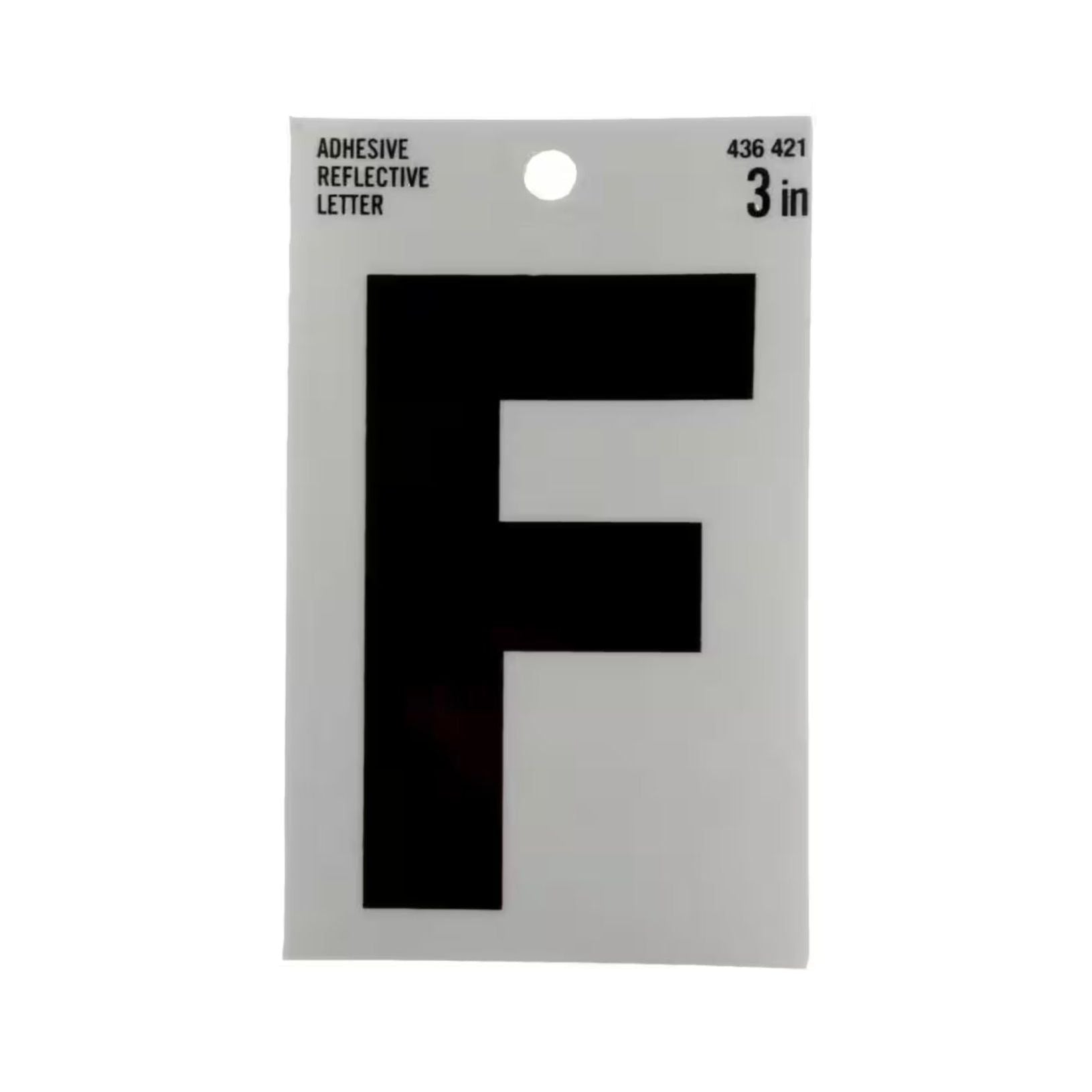 The image features a package of Simpson Strong-Ties EVERBILT 3 in. Vinyl Reflective Letter F, designed for improved visibility and safety. The white packaging has black text and a circular hole at the top for easy hanging.